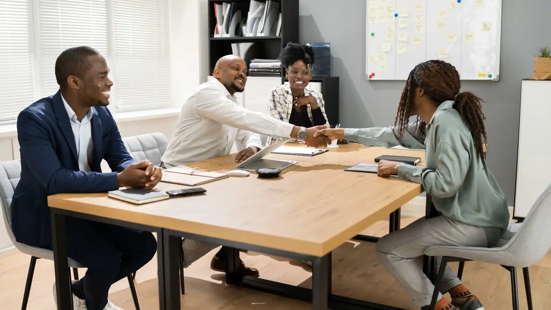 Finance team meeting with a candidate during a hiring discussion, representing how businesses evaluate and select the best staffing firms for finance professionals to hire faster and smarter.